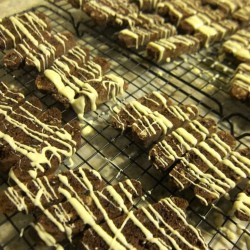 Triple Chocolate Biscotti with Cherries, Pecans, and White Chocolate Drizzle